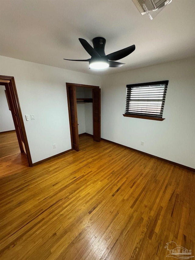 7920 Reeders Ln, Pensacola, FL 32526 - unfurnished bedroom featuring baseboards, light wood finished floors, a closet, and ceiling fan