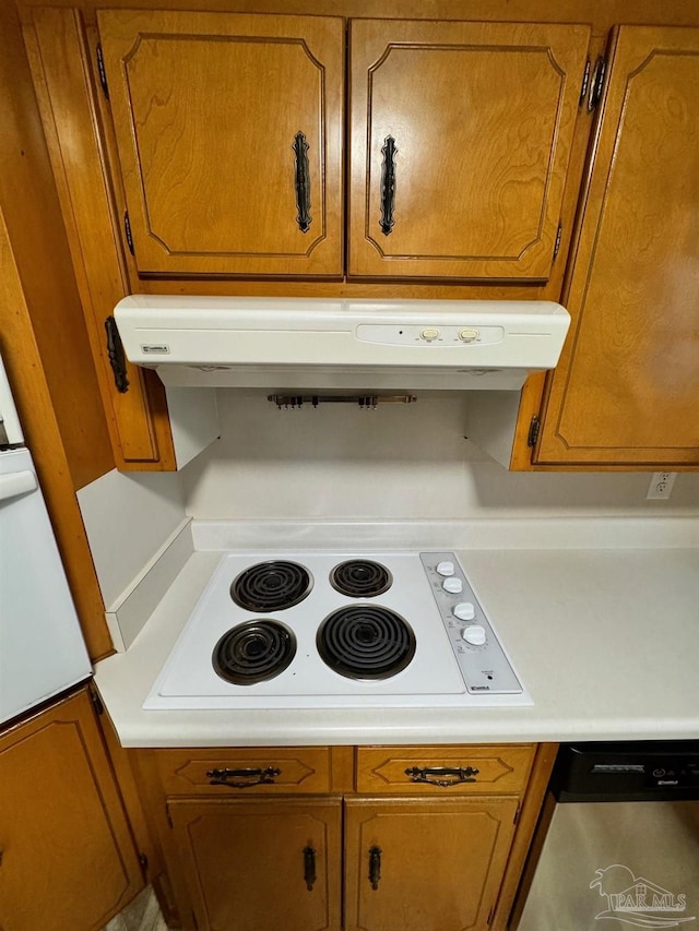 7920 Reeders Ln, Pensacola, FL 32526 - kitchen view of white electric cooktop, brown cabinets, stainless steel dishwasher, and light countertops