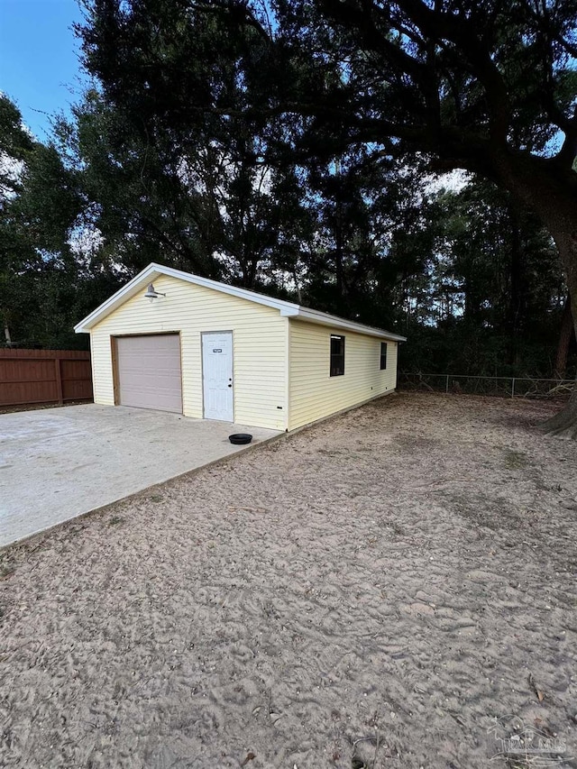 7920 Reeders Ln, Pensacola, FL 32526 - detached garage with fence and concrete driveway