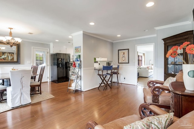 6031 Keating Rd, Pensacola, FL 32504 - living area with a chandelier, recessed lighting, wood finished floors, and crown molding