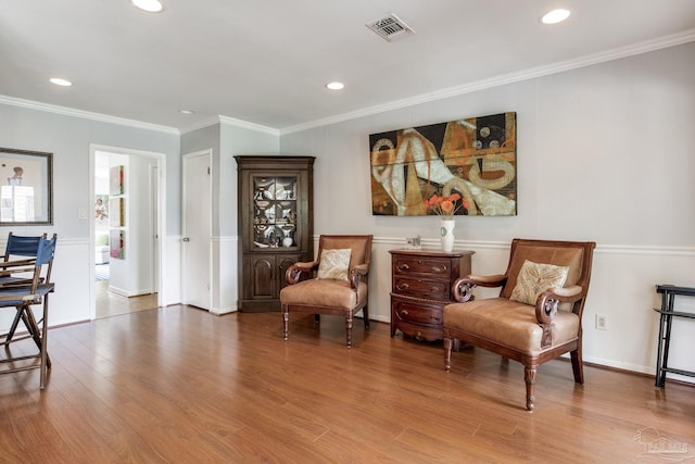 6031 Keating Rd, Pensacola, FL 32504 - sitting room with wood finished floors, recessed lighting, and ornamental molding