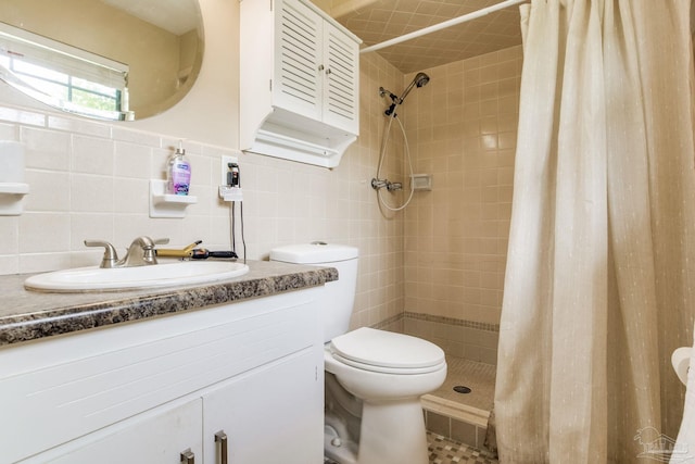 6031 Keating Rd, Pensacola, FL 32504 - full bathroom featuring vanity, tiled shower, and tile walls