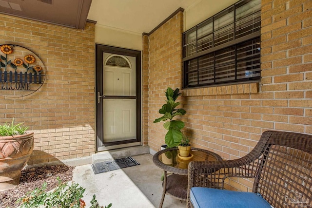 6031 Keating Rd, Pensacola, FL 32504 - doorway to property featuring brick siding and covered porch