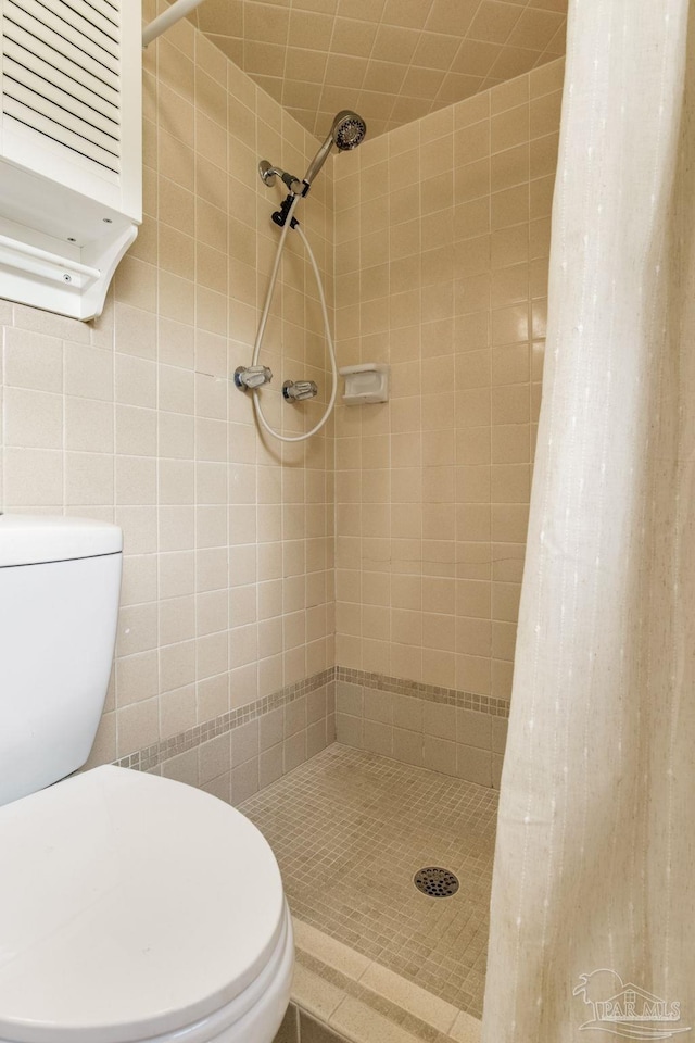 6031 Keating Rd, Pensacola, FL 32504 - bathroom featuring a shower stall and tile walls