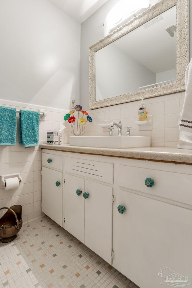 6031 Keating Rd, Pensacola, FL 32504 - bathroom featuring tile walls, vanity, and wainscoting