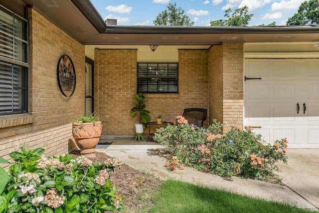 6031 Keating Rd, Pensacola, FL 32504 - doorway to property with brick siding and an attached garage