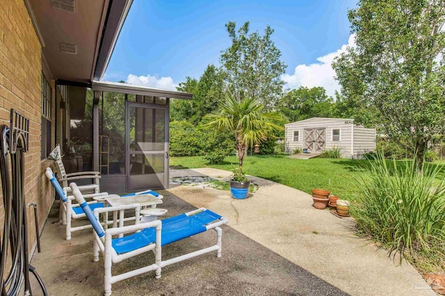 6031 Keating Rd, Pensacola, FL 32504 - view of patio featuring a sunroom and a shed