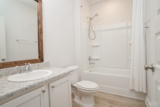 full bathroom with vanity, bathing tub / shower combination, toilet, and wood finished floors
