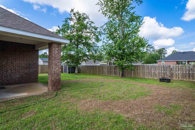 view of yard featuring a patio and a fenced backyard