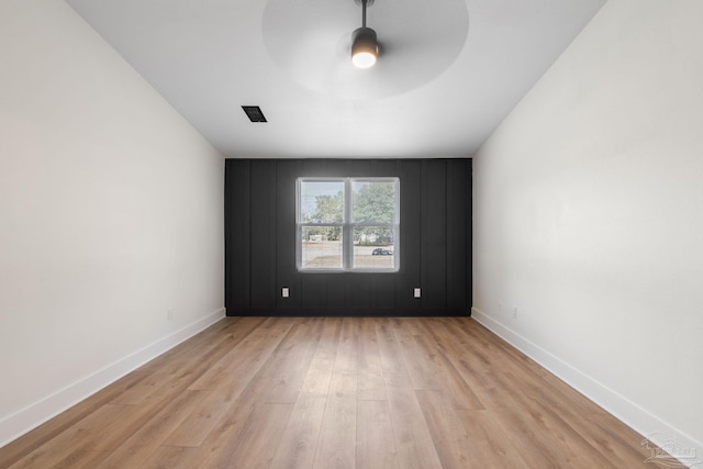 spare room featuring light wood-type flooring