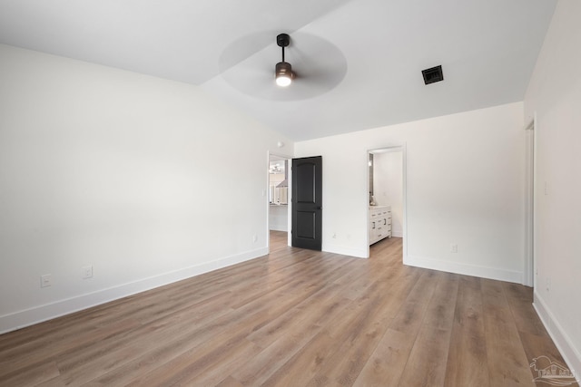 unfurnished bedroom featuring ensuite bathroom, ceiling fan, and light hardwood / wood-style floors