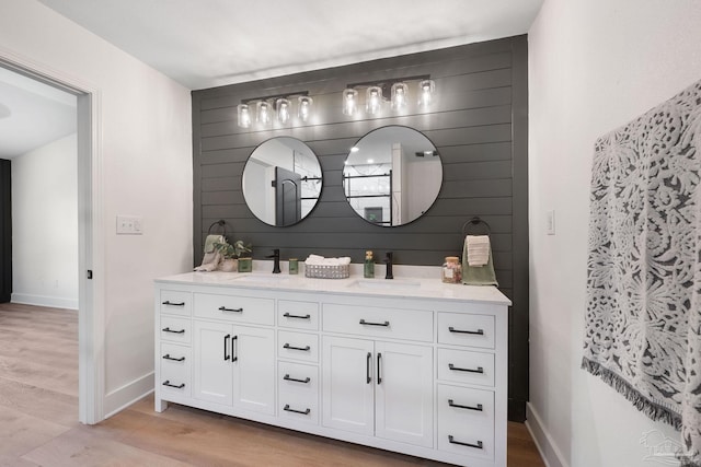 bathroom with wood-type flooring and vanity