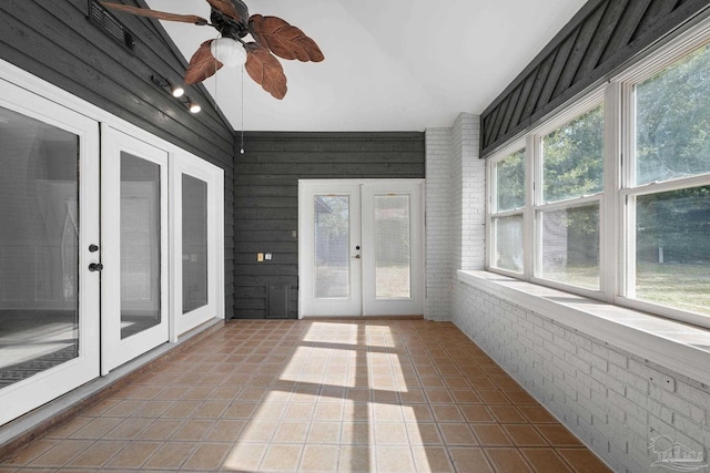 unfurnished sunroom with french doors, ceiling fan, and lofted ceiling