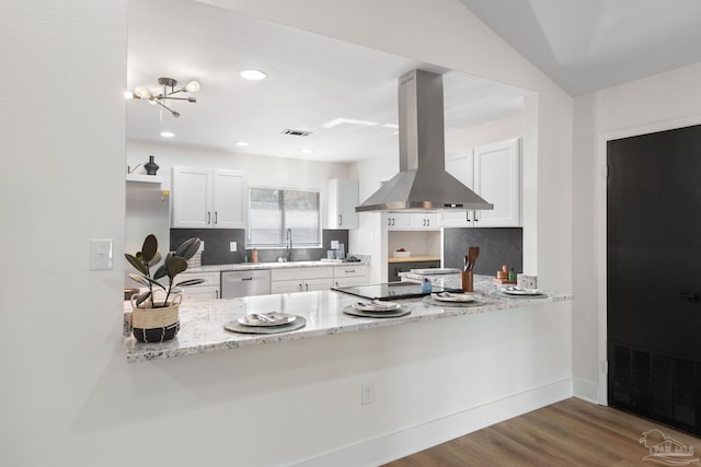 kitchen featuring white cabinetry, decorative backsplash, island exhaust hood, stainless steel dishwasher, and light stone countertops