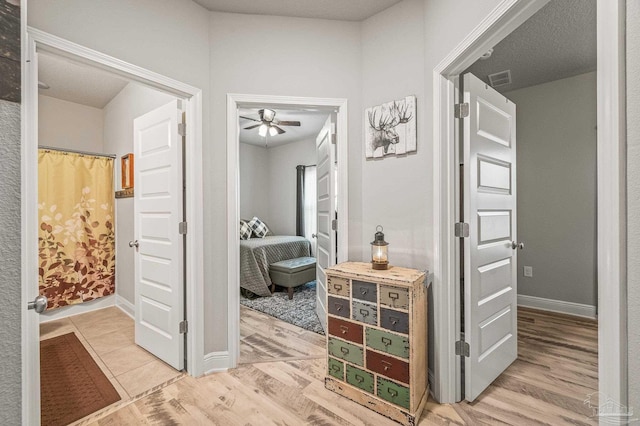 8056 Stream Ridge Rd, Pensacola, FL 32526 - corridor with light wood finished floors and baseboards