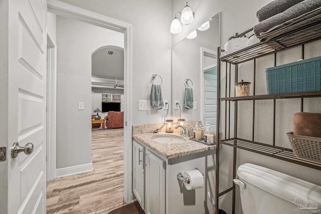 8056 Stream Ridge Rd, Pensacola, FL 32526 - bathroom featuring wood finished floors, toilet, vanity, and baseboards