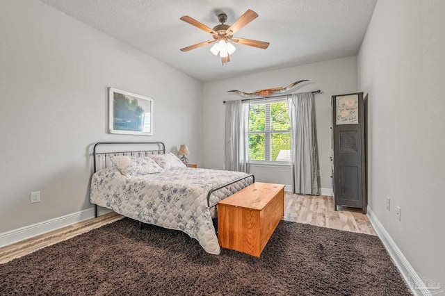 8056 Stream Ridge Rd, Pensacola, FL 32526 - bedroom featuring light wood-type flooring, a textured ceiling, baseboards, and a ceiling fan