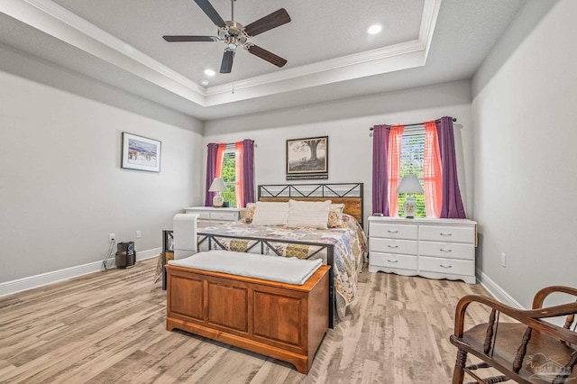8056 Stream Ridge Rd, Pensacola, FL 32526 - bedroom with crown molding, light wood-type flooring, multiple windows, a raised ceiling, and baseboards