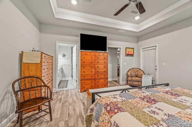 8056 Stream Ridge Rd, Pensacola, FL 32526 - bedroom with wood finished floors, ornamental molding, baseboards, a raised ceiling, and connected bathroom