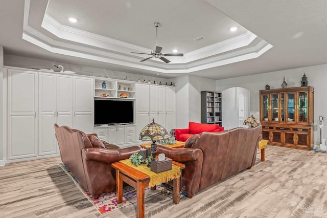 8056 Stream Ridge Rd, Pensacola, FL 32526 - living area with a raised ceiling, ornamental molding, light wood-style floors, ceiling fan, and arched walkways