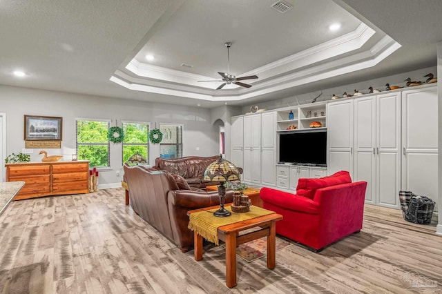 8056 Stream Ridge Rd, Pensacola, FL 32526 - living area featuring a raised ceiling, light wood-style flooring, crown molding, ceiling fan, and recessed lighting