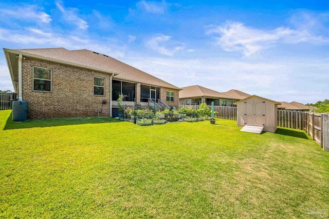 8056 Stream Ridge Rd, Pensacola, FL 32526 - rear view of property with a storage unit, brick siding, an outbuilding, a sunroom, and a shingled roof