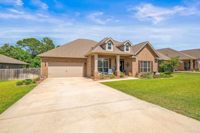 8056 Stream Ridge Rd, Pensacola, FL 32526 - view of front facade featuring brick siding, driveway, an attached garage, and covered porch