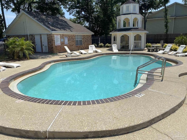 view of pool featuring a patio area