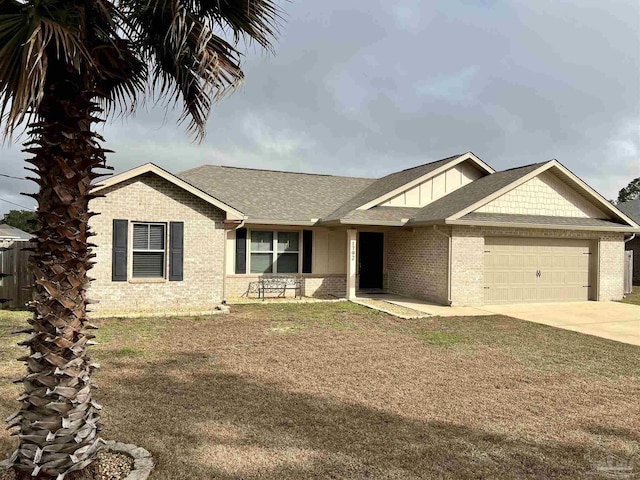 view of front of home featuring a garage and a front lawn