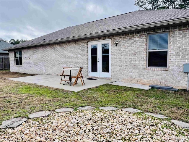 1792 Galvez Dr, Gulf Breeze, FL 32563 - rear view of property featuring a lawn, a patio, and french doors