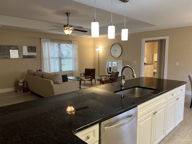 1792 Galvez Dr, Gulf Breeze, FL 32563 - kitchen featuring sink, white cabinetry, hanging light fixtures, dishwasher, and dark stone counters