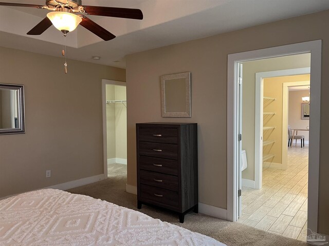 1792 Galvez Dr, Gulf Breeze, FL 32563 - bedroom featuring ceiling fan, a spacious closet, and a closet