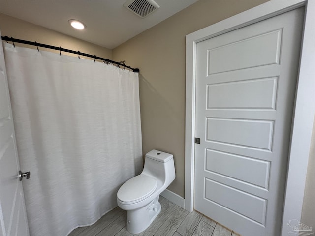 1792 Galvez Dr, Gulf Breeze, FL 32563 - bathroom featuring toilet and hardwood / wood-style floors