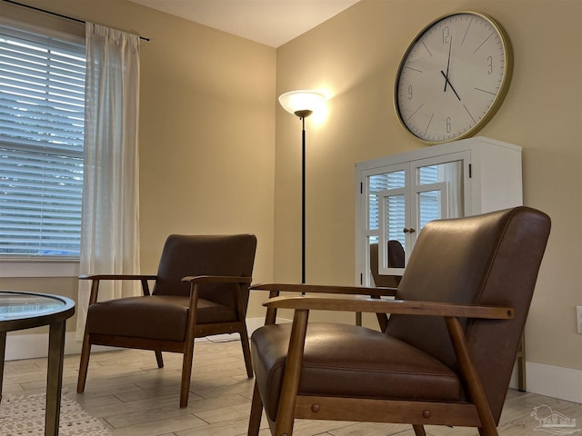 1792 Galvez Dr, Gulf Breeze, FL 32563 - sitting room featuring french doors, plenty of natural light, and light hardwood / wood-style floors