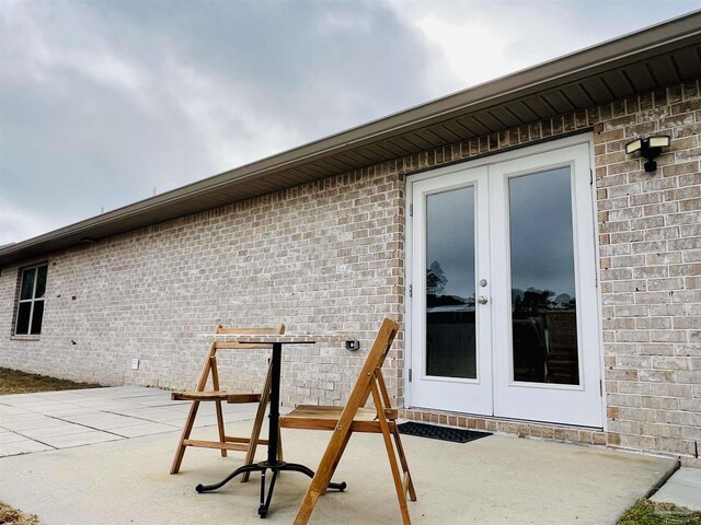 1792 Galvez Dr, Gulf Breeze, FL 32563 - view of patio / terrace featuring french doors