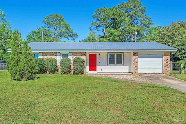 2382 Ryale Rd, Cantonment, FL 32533 - ranch-style home featuring a garage, brick siding, concrete driveway, and metal roof