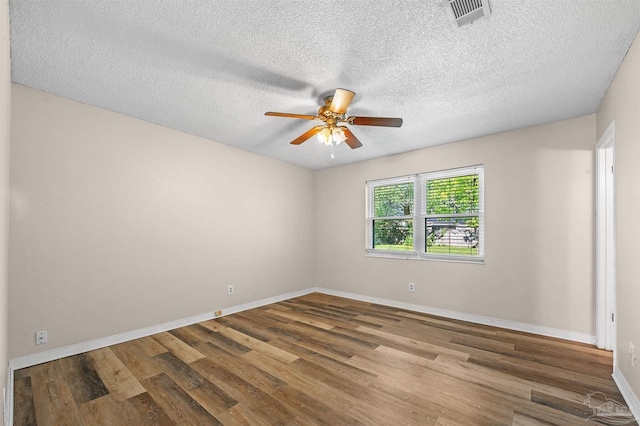 2382 Ryale Rd, Cantonment, FL 32533 - empty room with a ceiling fan, wood finished floors, baseboards, and a textured ceiling