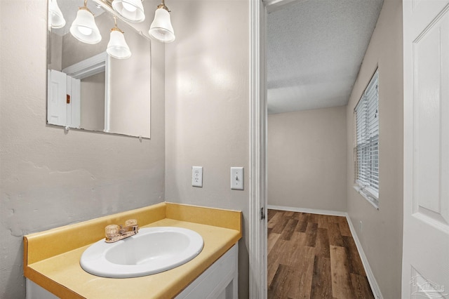 2382 Ryale Rd, Cantonment, FL 32533 - bathroom with wood finished floors, vanity, and baseboards