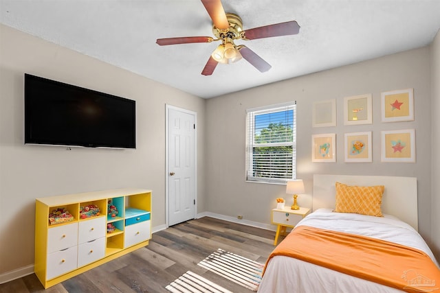 2382 Ryale Rd, Cantonment, FL 32533 - bedroom with baseboards, wood finished floors, and a ceiling fan