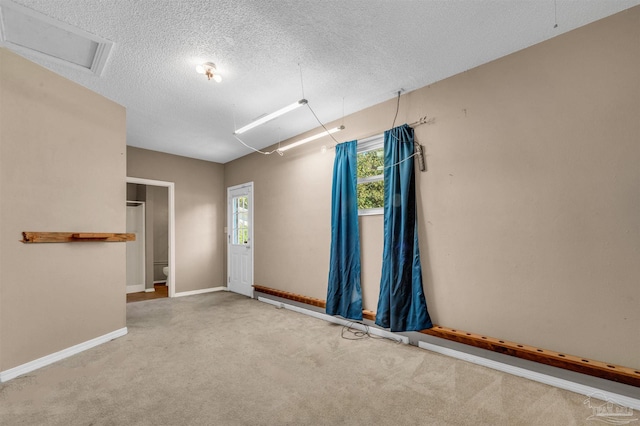 2382 Ryale Rd, Cantonment, FL 32533 - carpeted spare room featuring a textured ceiling and baseboards
