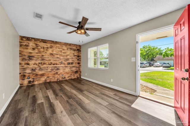 2382 Ryale Rd, Cantonment, FL 32533 - unfurnished room featuring wood finished floors, ceiling fan, baseboards, and a textured ceiling