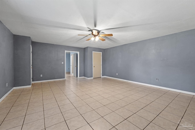 2382 Ryale Rd, Cantonment, FL 32533 - empty room featuring a ceiling fan, baseboards, and light tile patterned floors