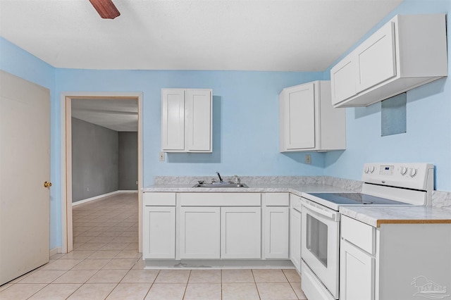 2382 Ryale Rd, Cantonment, FL 32533 - kitchen featuring white electric stove, a sink, light tile patterned flooring, and light countertops