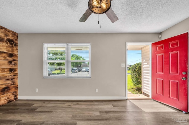 2382 Ryale Rd, Cantonment, FL 32533 - entryway with ceiling fan, a textured ceiling, wood finished floors, and baseboards