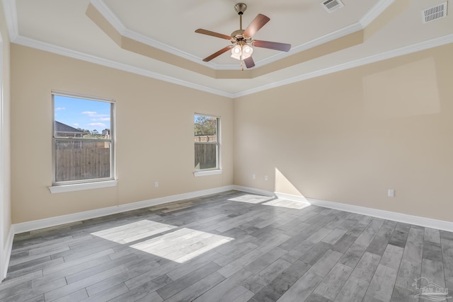 unfurnished room with hardwood / wood-style flooring and crown molding