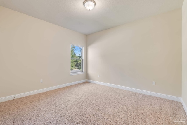 empty room featuring carpet flooring