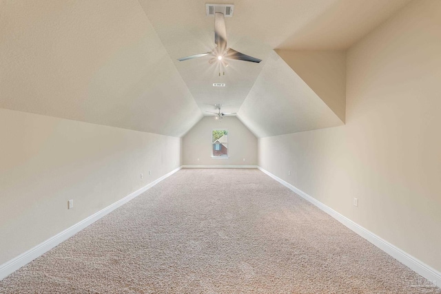 additional living space featuring carpet, ceiling fan, and lofted ceiling