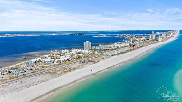 aerial view with a water view and a beach view