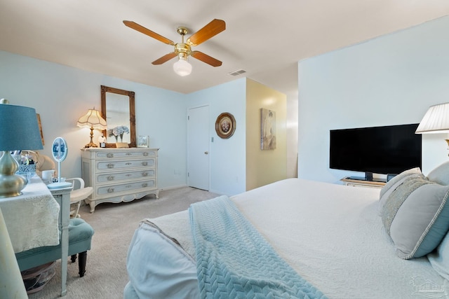 carpeted bedroom with ceiling fan