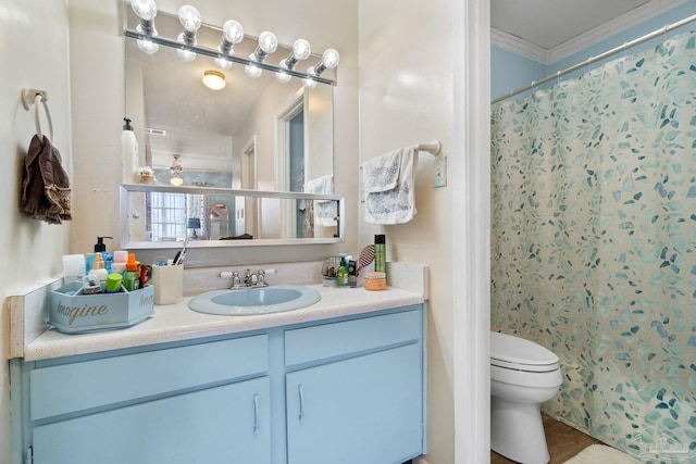 bathroom featuring toilet, crown molding, curtained shower, and vanity